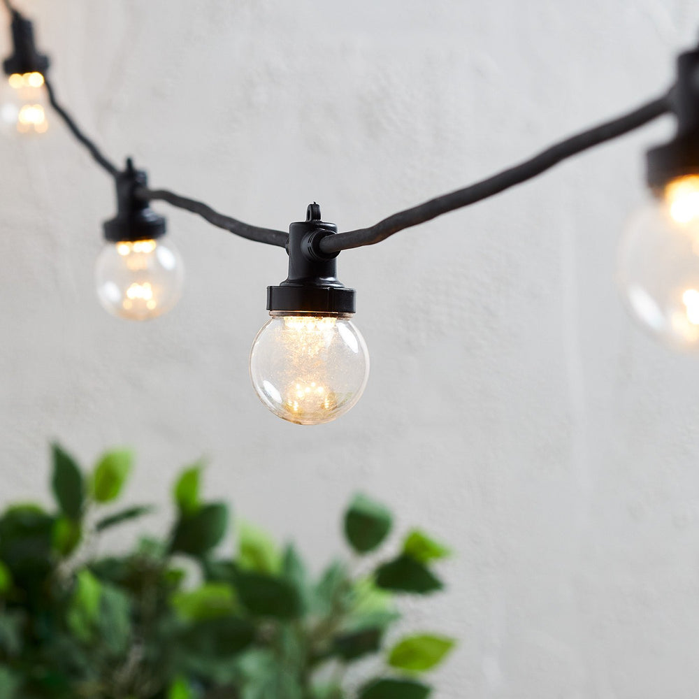 guirlande-guinguette-pro-connect-100m-200-led-blanc-chaud-cable-noir-raccordable-ampoules-transparentes
