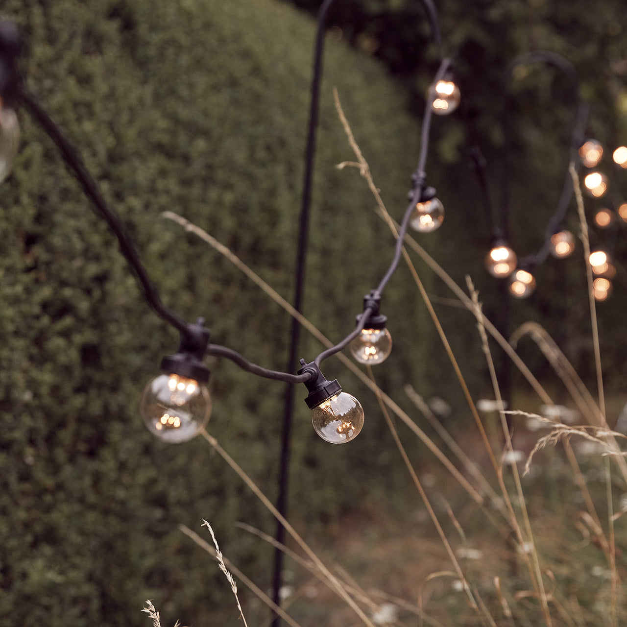 Guirlande Guinguette Pro Connect 60m 120 LED Blanc Chaud Câble Noir Raccordable Ampoules Transparentes