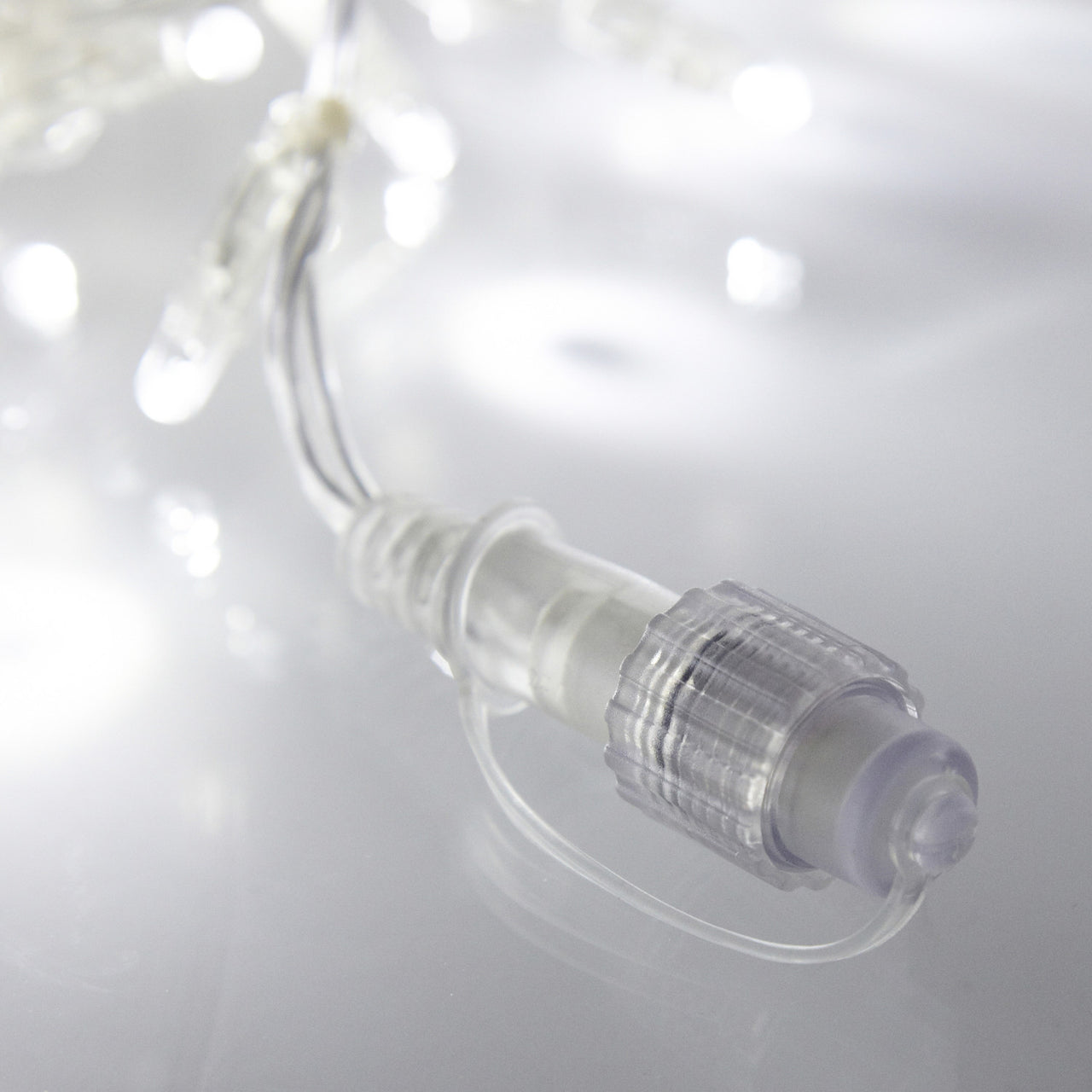 Filet Lumineux Raccordable 140 LED Blanches Câble Transparent 2 x 2m